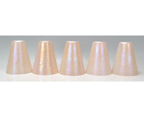 A collection of five 20th century retro conical lustre glass lamp shades. Each of conical form with white pearl lustre colour