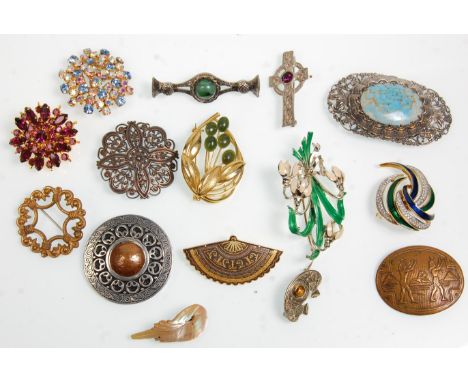 A good collection of fifteenth vintage ladies brooches to include a Scottish brooch examples set with coloured stones, mother