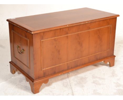 A good quality yew wood Regency revival blanket box chest being raised on bracket feet with fielded panel sides having hinged