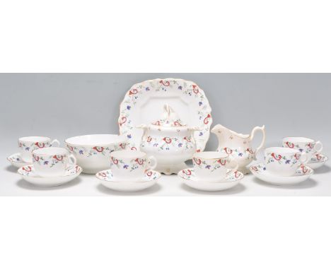 A 19th Century Victorian china coffee service having white ground with blue, red and green floral and scroll decoration with 