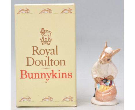 Rare - A Royal Doulton Bunnykins ceramic figure Santa Bunnykins 'Happy Christmas' Christmas tree ornament DB62 in a white col