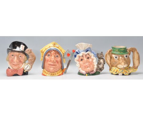 A group of four Royal Doulton ceramic character jugs to include Mad Hatter C6598, The March Hare D 6776, The Red Queen D 6777