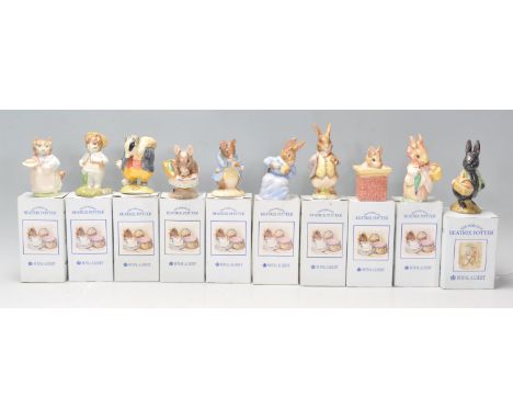 A group of nine Royal Albert 'The World Of Beatrix Potter' ceramic figures to include Mrs Ribby, Tommy Brock, Appley Dapply, 