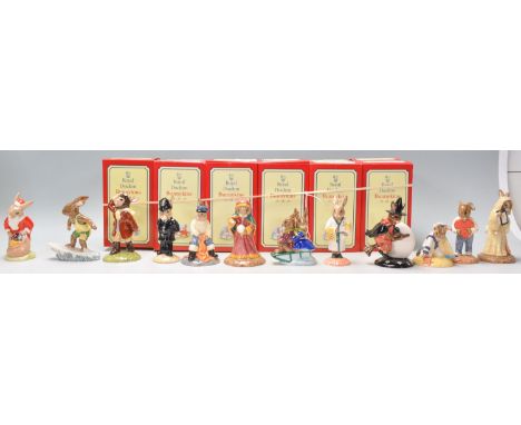 A group of twelve Royal Doulton Bunnykins ceramic figures to include an unusual Santa Bunnykins "Happy Christmas" DB 17 havin