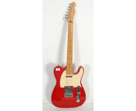 A Squier six string telecaster by Fender series electric guitar having a red painted body with white scratchboard, chrome con