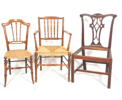 A harlequin set of antique chairs to include a 19th Century Georgian Chippendale style chair frame, a rush seat carver with a