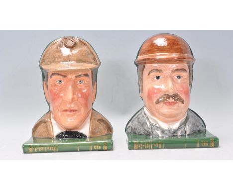 A pair of Royal Doulton ceramic bookends one in the form Sherlock Holmes D7038 and the other Dr. Watson D7039. Both raised on