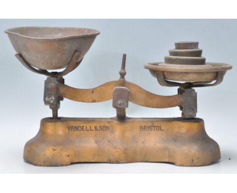 A pair of 19th Century Victorian local Bristol interest balance shop scales having a gilt base with painted Yandell &amp; Son