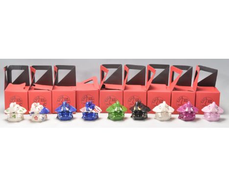 A collection of nine elephant ceramic Kevin Francis face pots to include Nellie in various coloured, Flower Power Nellie, Pat