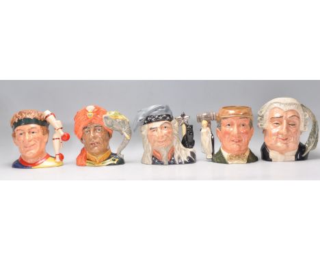 A group of five Royal Doulton ceramic Character / Toby jugs to include The Juggler D6835, The Elephant Trainer D6841, The Wiz