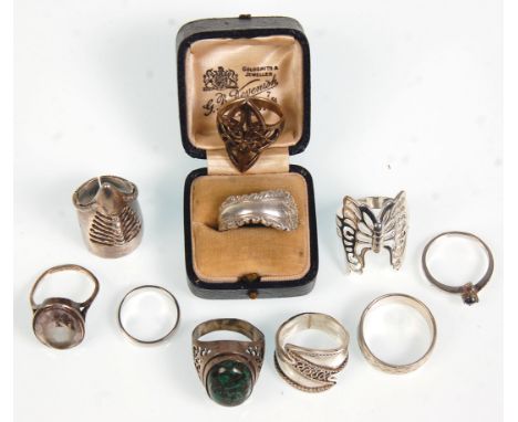 A group of ten silver ladies rings to include a butterfly ring and another decorative claw ring, engraved band ring, a Walker