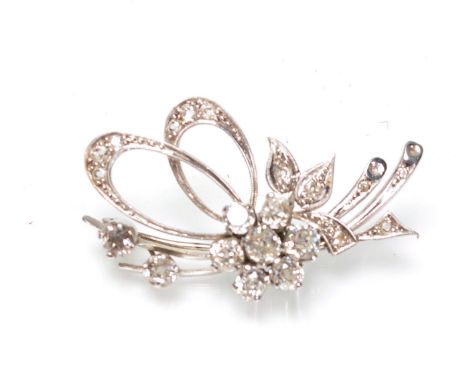 A stunning vintage mid 20th Century platinum and diamond brooch in the form of a floral bouquet having a cluster of seven mix