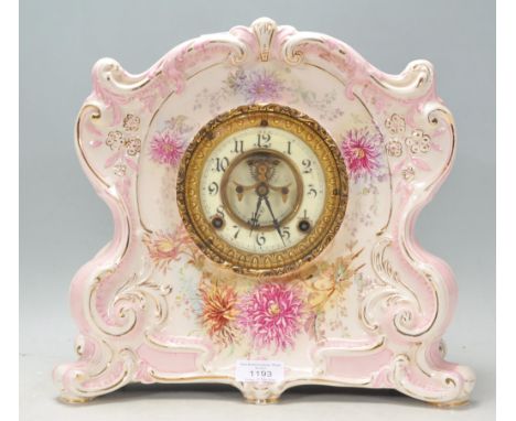 A 19th Century Victorian large Royal Bonn porcelain cased mantel clock of scrolled form with pink and gilt accent and floral 