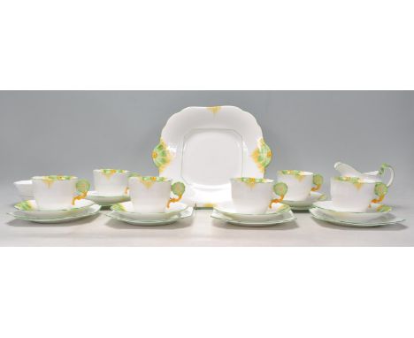 A vintage 1920's / 1930's Art Deco Aynsley 21 piece rare fine bone china tea service having a white ground hand painted with 