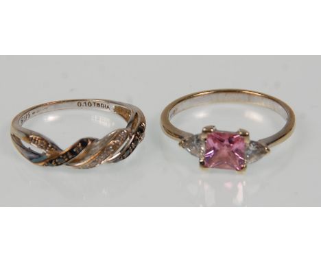 Two 9ct white gold ladies rings. One set with a square cut pink stone flanked by CZs. Hallmarked for Birmingham Import. Ring 