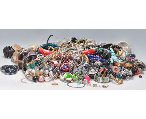 A large collection of vintage 20th Century costume jewellery to include a wide selection of beaded necklaces, bangles, bracel
