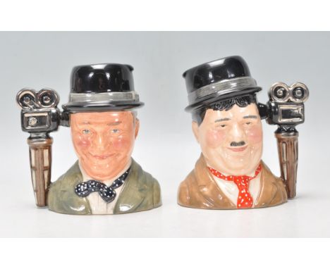 Laurel &amp; Hardy - Two Royal Doulton ceramic Character / Toby jugs one of Stan Laurel D7008 and Oliver Hardy D7009. Both li