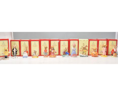 A group of twelve Royal Doulton Bunnykins ceramic figurines to include Rainy Day DB 147, Lawyer Bunnykins DB 214 (signed), Ha