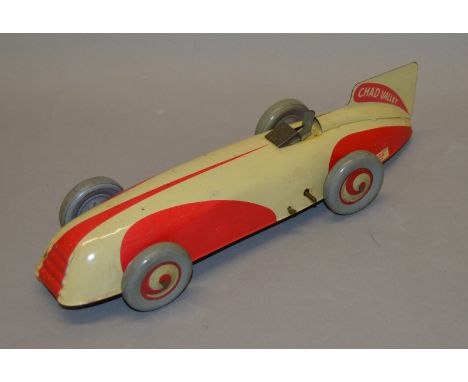 An unboxed tinplate Chad Valley streamlined Racing Car model, approximately 29cm long. The model has&nbsp; red and cream pain