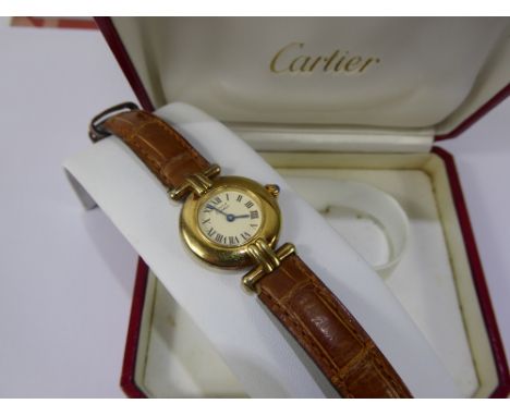 A Lady's Vintage Silver Gilt Cartier Wrist Watch, white enamel face with Roman dial,  the case nr 008912, on genuine leather 