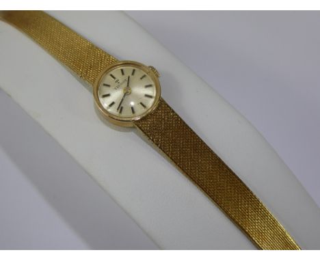A Lady's 9 ct Gold Tissot Wrist Watch, the watch having a champagne dial with baton markers, case nr 78010, movement nr 16855
