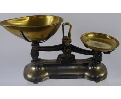 A Set of Libra Scale Co Vintage Kitchen Scales, with a small quantity of weights.