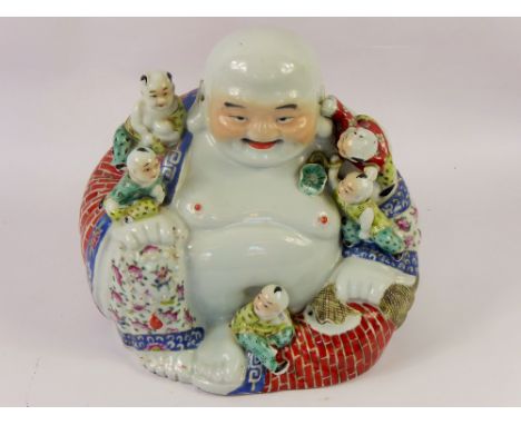A Decorative Ceramic Figure of The Laughing Buddha, depicted seated with clambering children, approx 27 cms