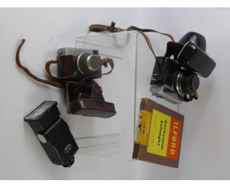 A Miscellaneous Collection of Cameras and Camera Equipment, including a Cullmann 41 camera stand, an Olympus-Pen F mount adap