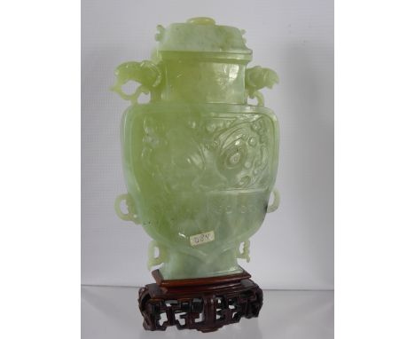 Chinese 20th Century White Jade Vase and Cover, the vase of flattened shield form with carved acanthus leaves to the bottom. 