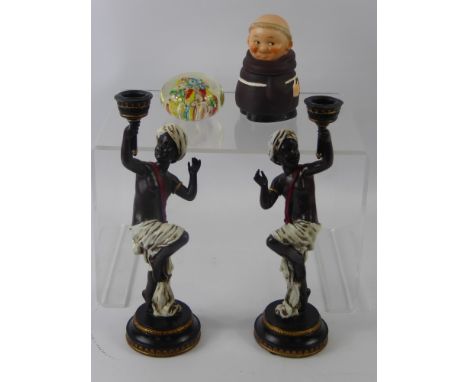A Pair of Resin Blackamoor Candlesticks, together with a Goebel Friar and a Millefiori Glass Paperweight.