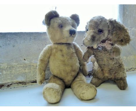 A pre-war Mohair Teddy Bears in the form of a dog , together with another Teddy Bear having articulated limbs and glass eyes,