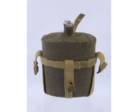 A Vintage Military Cloth Covered Enamelled Hip Flask, having original felt cover and canvas webbing.