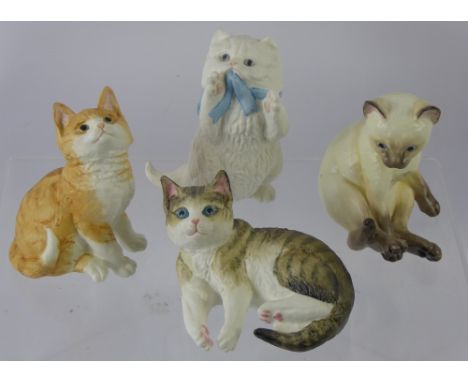 Four Royal Worcester Feline Figurines, including Siamese, Ginger, Tabby and a Persian. (4)