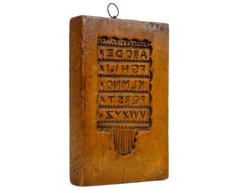 Hornbook Mould. A wooden gingerbread hornbook mould, circa 1800 , block of beech wood, hand-carved in intaglio to one side wi