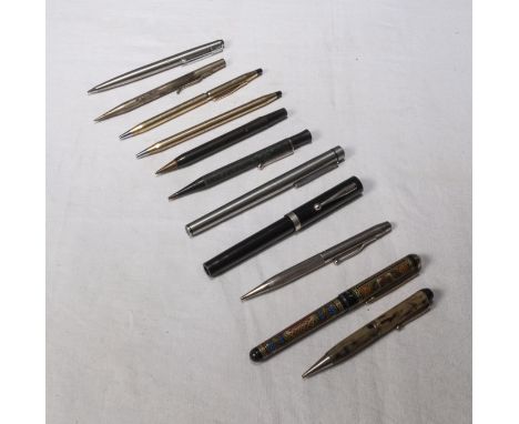 A collection of vintage fountain pens and pencils