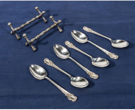 Six silver coffee spoons and two plated knife rests