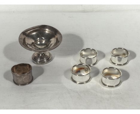 Two pieces of scrap silver and four plated napkin rings