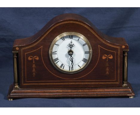 An Edwardian inlaid mahogany mantle clock