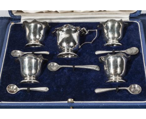 A cased set of silver salts and associated spoons