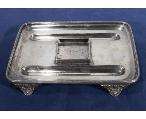 A silver plated pen tray
