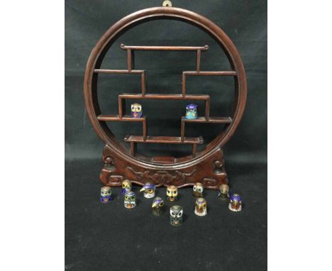 COLLECTION OF CHINESE CLOISONNE ENAMEL THIMBLESmodelled as birds heads, in a miniature wooden display stand, the stand 30cm h