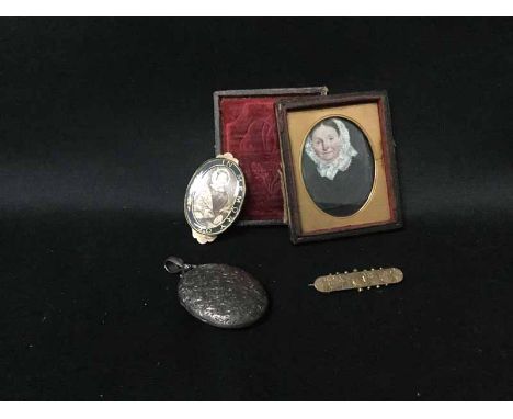 SILVER OVAL LOCKET ENGRAVED WITH FOLIAGE also a Victorian memento mori brooch; a nine carat gold bar brooch and a small minia