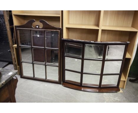 A MAHOGANY BOW FRONTED OVER MANTEL MIRROR WITH NINE FRAMED BEVELLED EDGE OBLONG MIRROR PANELS AND BASAL SHELF, 3'1" WIDE, 2'7