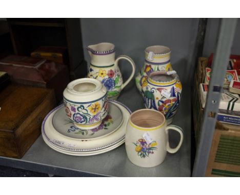 NINE PIECES OF POOLE POTTERY TO INCLUDE; JUGS, VASES AND PLATES, TYPICAL FLORAL DECORATION (9) 
