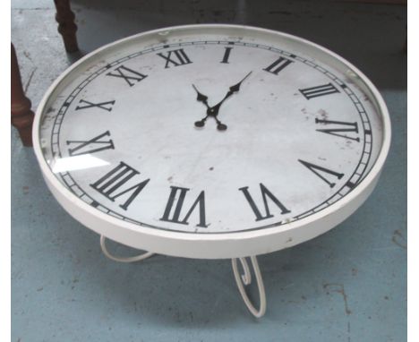 LOW TABLE, the top inset a clock face, wrought metal supports, 81cm diam x 48cm H.