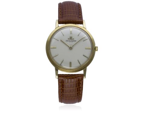 A GENTLEMAN'S 18K SOLID GOLD JAEGER LECOULTRE WRIST WATCH CIRCA 1960s 
D: Silver dial with gilt batons & hands. M: Manual win