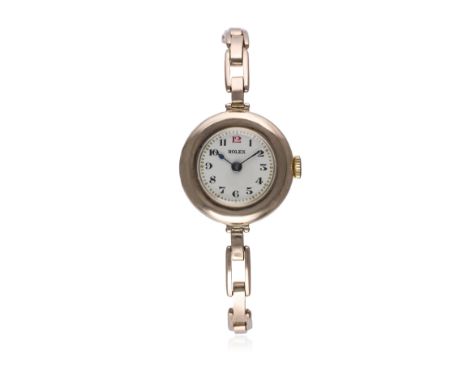 A LADIES 9CT SOLID ROSE GOLD ROLEX BRACELET WATCH CIRCA 1920s 
D: Silver dial with Arabic numerals &amp; outer minute track. 
