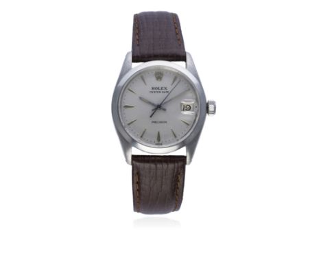 A MID SIZE STAINLESS STEEL ROLEX OYSTERDATE PRECISION WRIST WATCH CIRCA 1960, REF. 6466 
D: Silver dial with silver "dagger" 