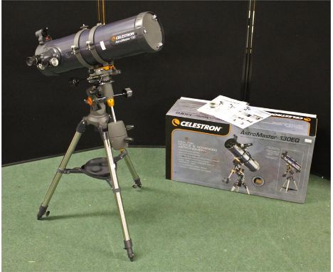 Celestron astromaster 130 Reflctor telescope and tripod, boxed.