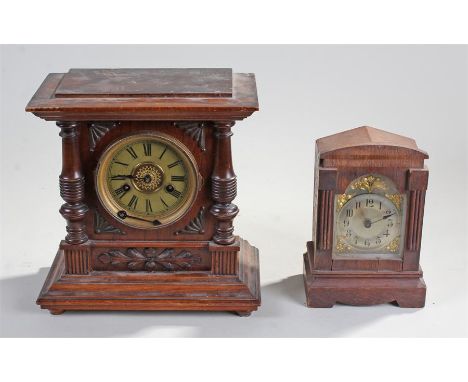 German mantel clock, moulded foliate decoraton to the front, with Roman hours, 30cm high, along with an oak cased clock with 